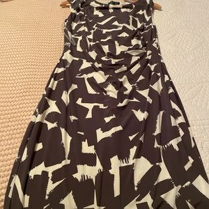 fitted knee length. Never worn but the tag fell off. Some ruching on the waist